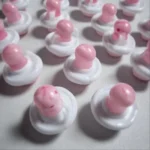 Colorful baby pacifiers designed as charming shower favors for celebrations.