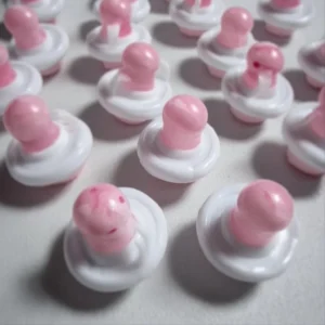 Colorful baby pacifiers designed as charming shower favors for celebrations.