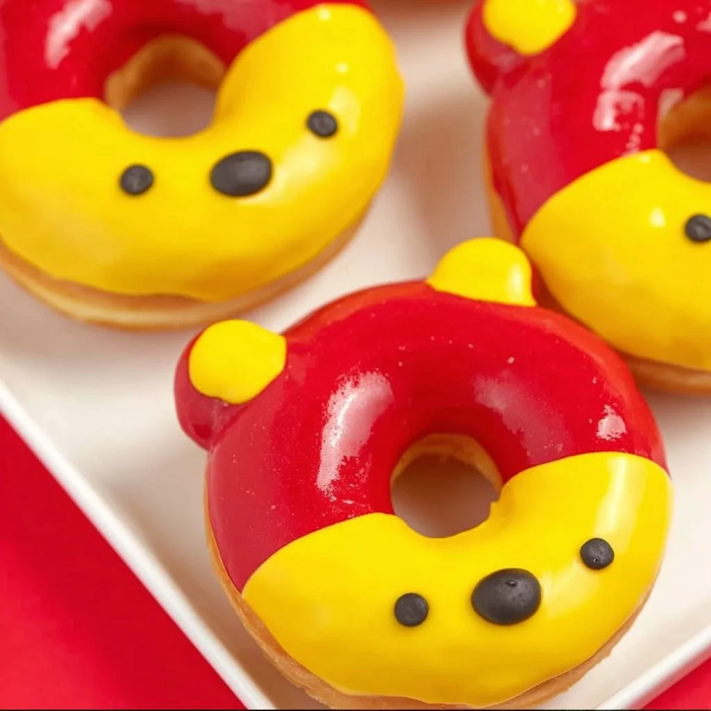 Winnie the Pooh Bear Donuts decorated with honey and cute bear faces